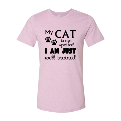 Pink t-shirt with black text and paw prints on a white background