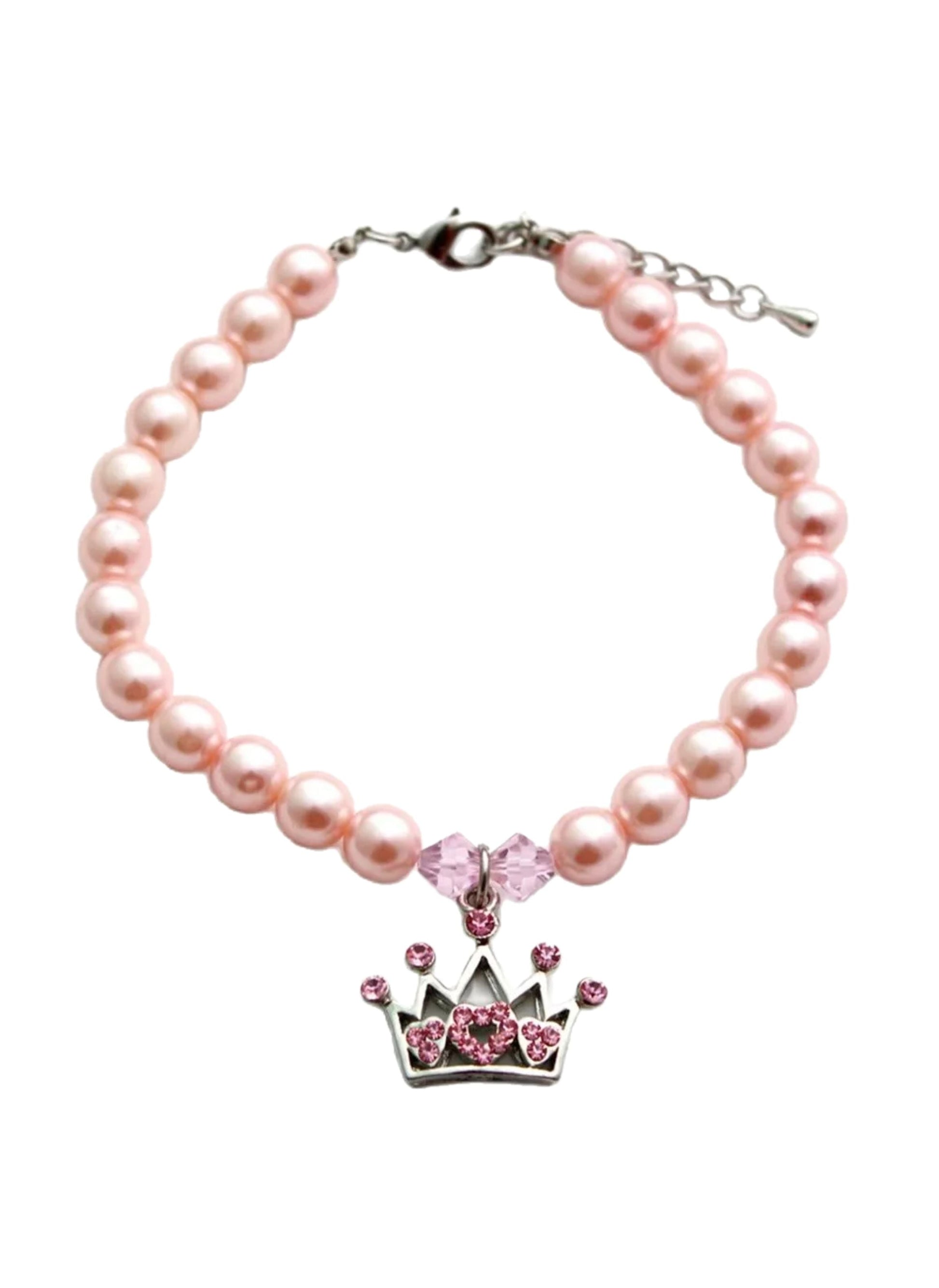 Pink pearl bracelet with a crown charm on a white background