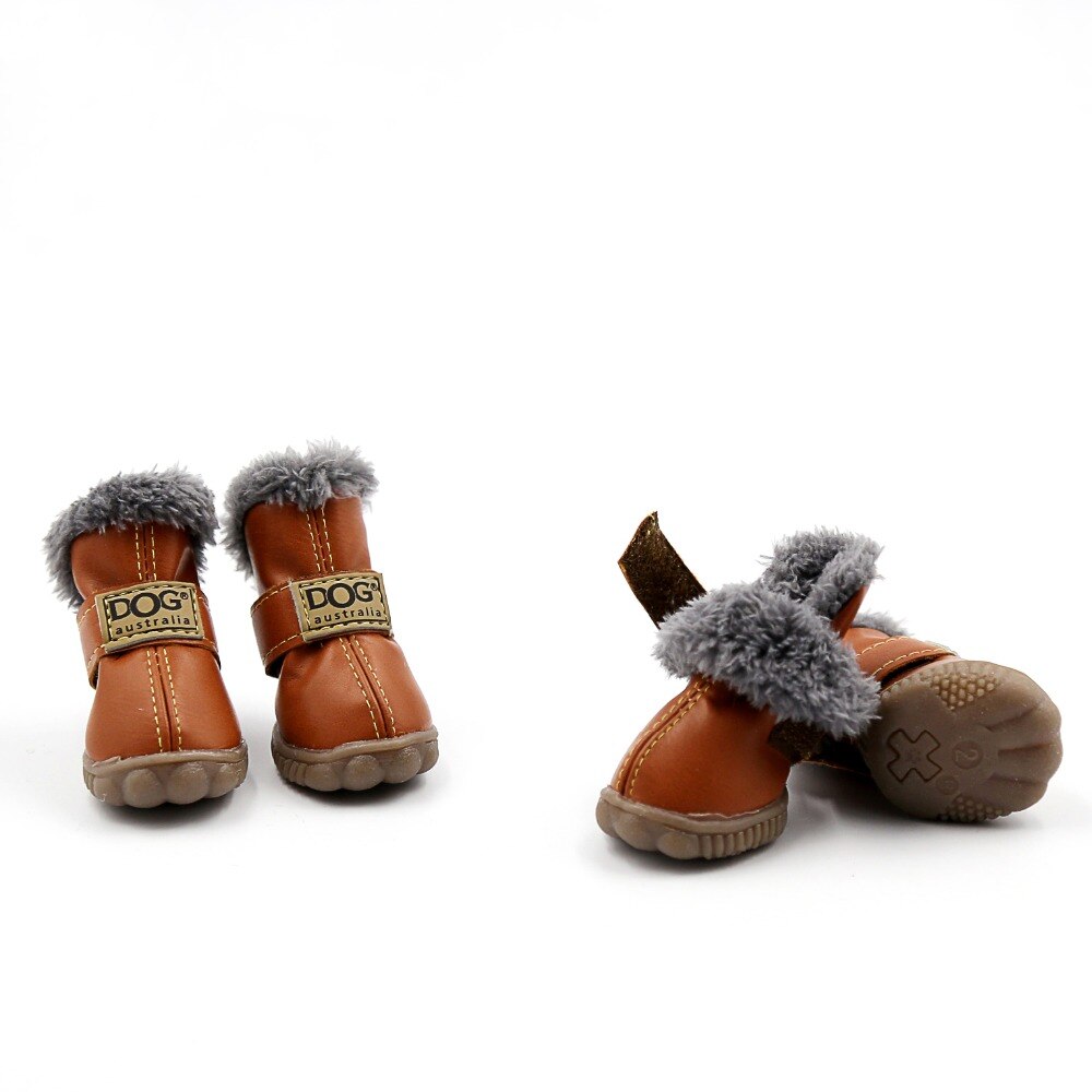 Pair of brown dog boots with gray fur trim on a white background