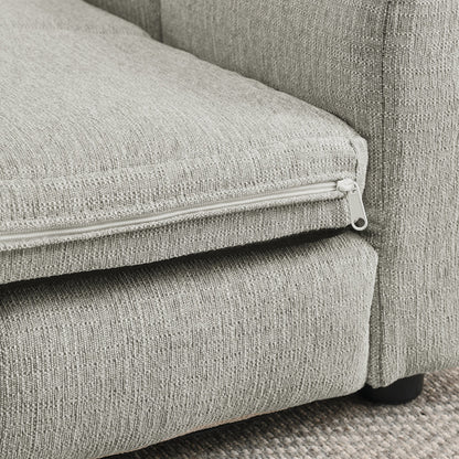 Gray fabric sofa with zipper detail on a textured surface