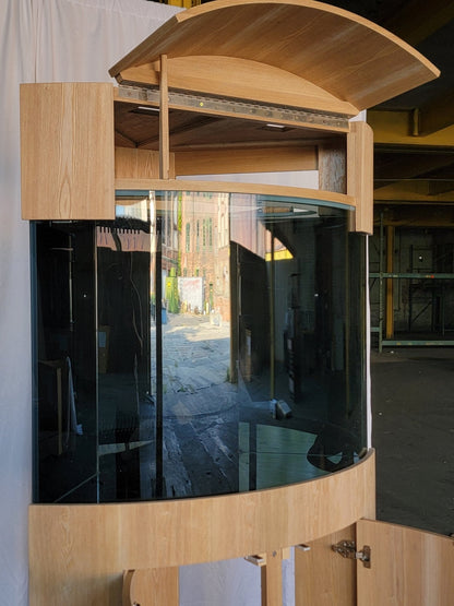 Wooden structure with glass panels in an indoor setting