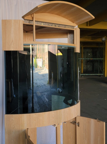 Wooden outdoor canopy with glass panel in an industrial setting