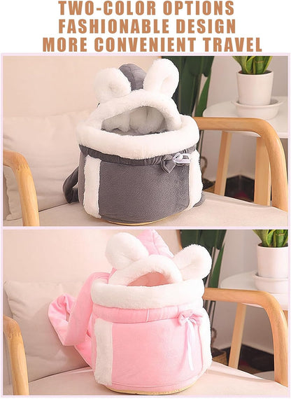 Two plush bags, one gray and one pink, with white accents on a chair.