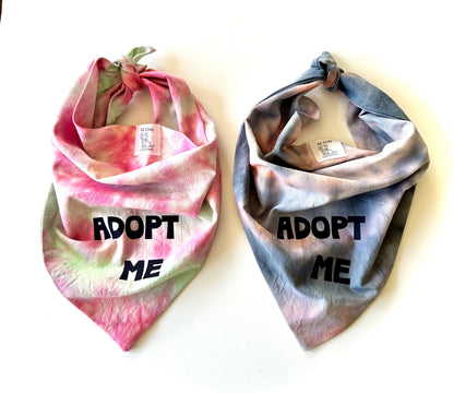 Two tie-dye dog bandanas with 'ADOPT ME' text on a white background