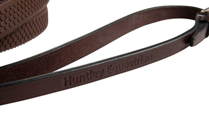Brown leather strap with 'Huntley Equestrian' branding on a white background