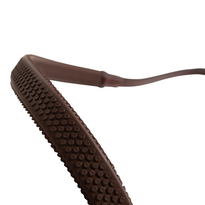 Brown sandal sole with textured surface on a white background