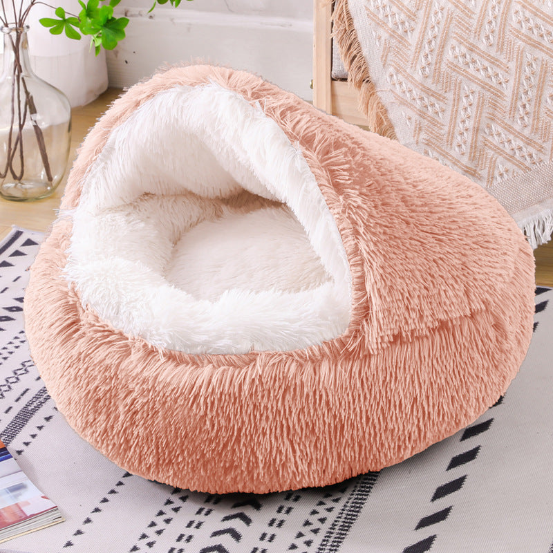 Fluffy pet bed with white interior on a patterned surface