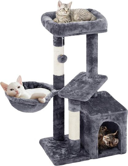Cat tree with multiple levels and a hammock on a white background