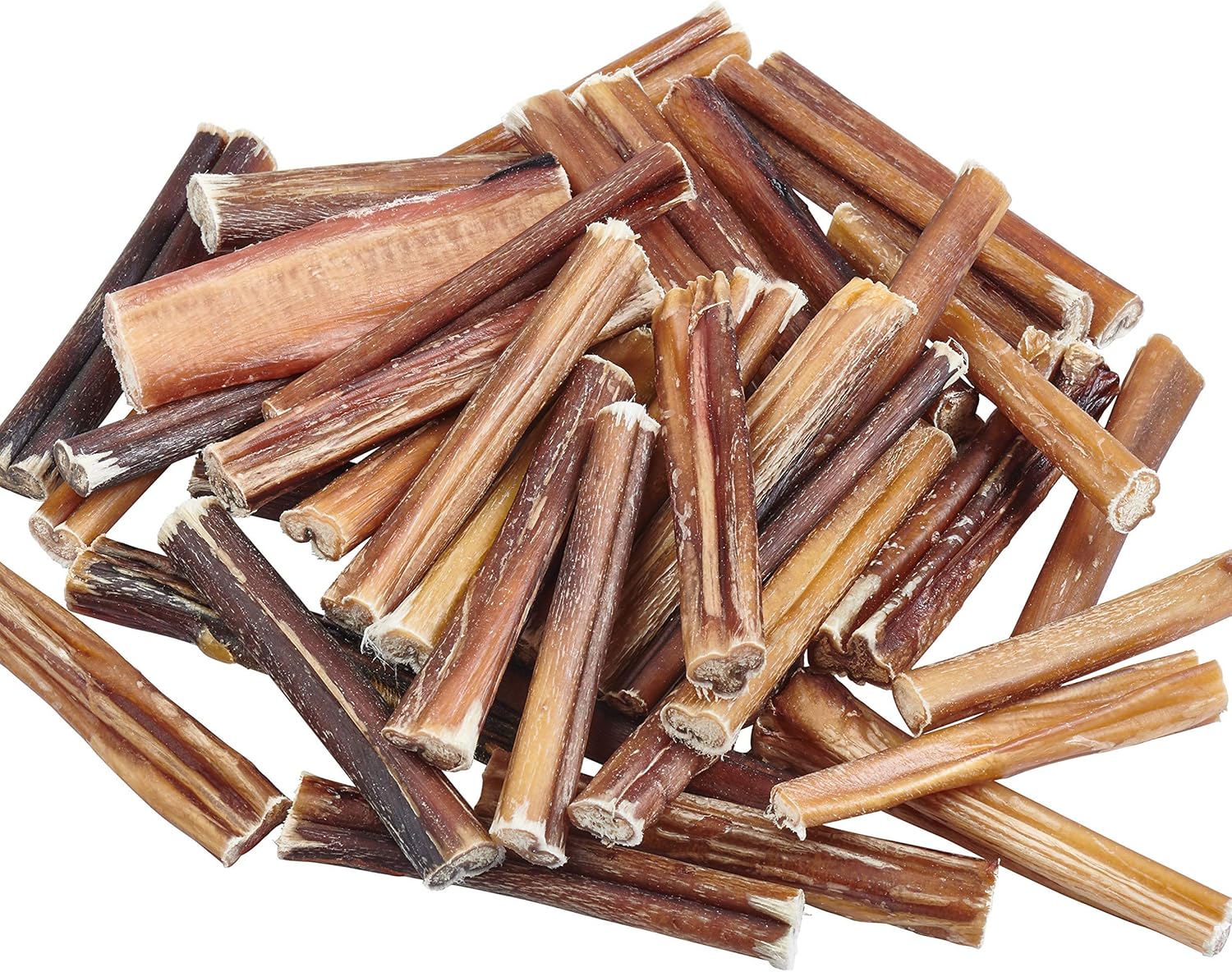 Heap of brown dog chew sticks on a white background