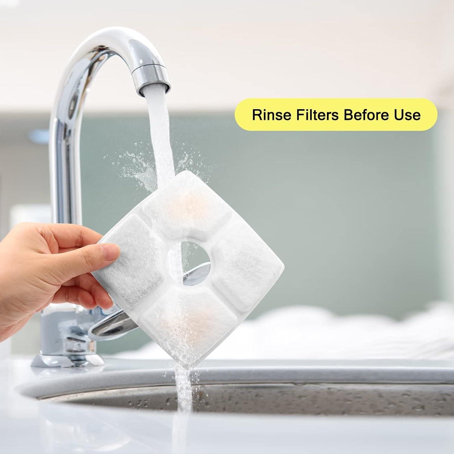 Filter being rinsed under running water from a faucet with text 'Rinse Filters Before Use'.