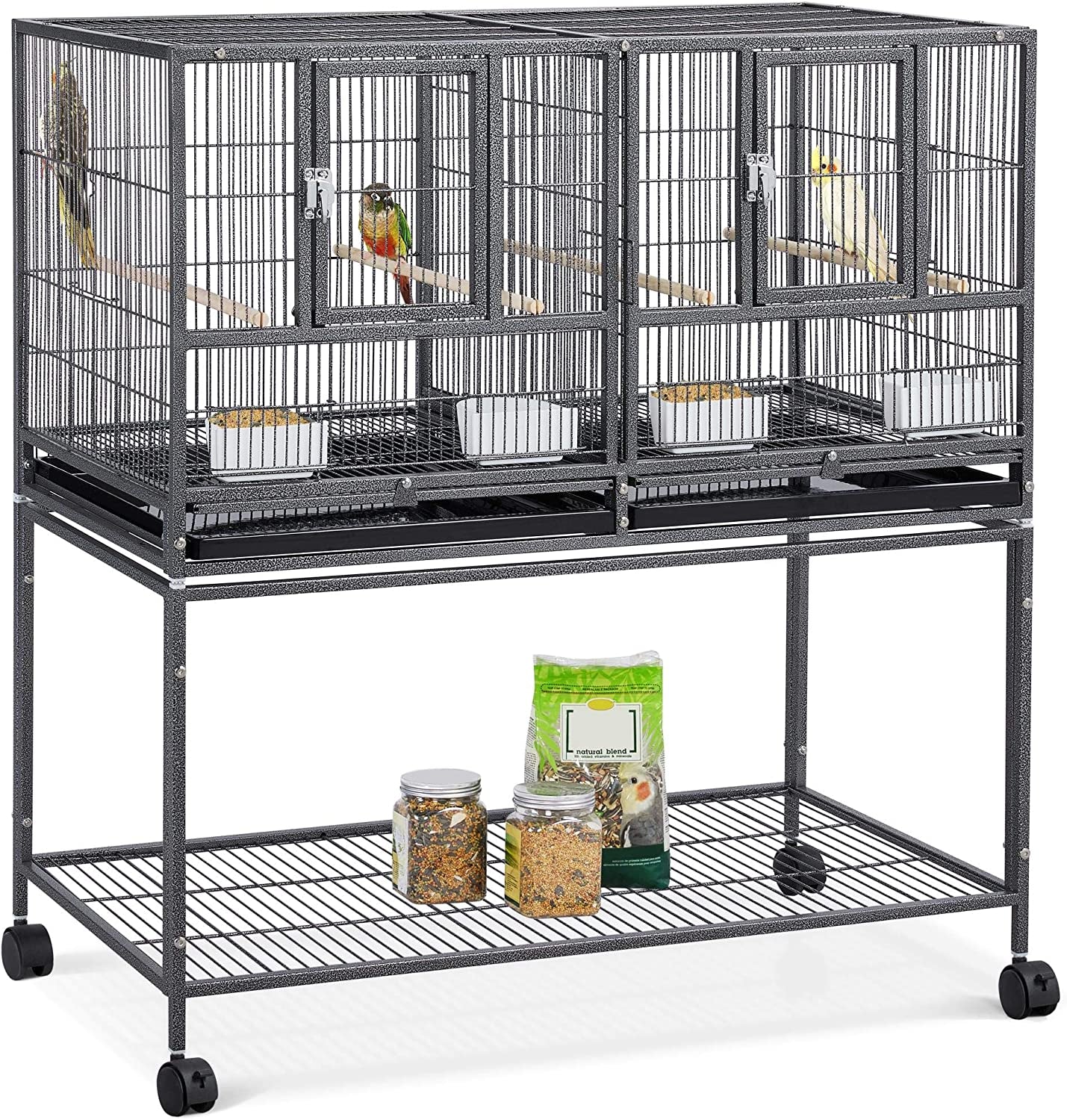 Large bird cage with multiple compartments and wheels on a white background