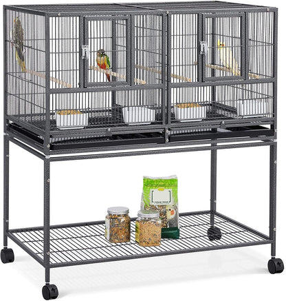 Large bird cage with multiple compartments and wheels on a white background