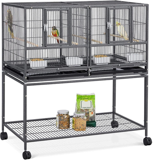 Large bird cage with multiple compartments and wheels on a white background
