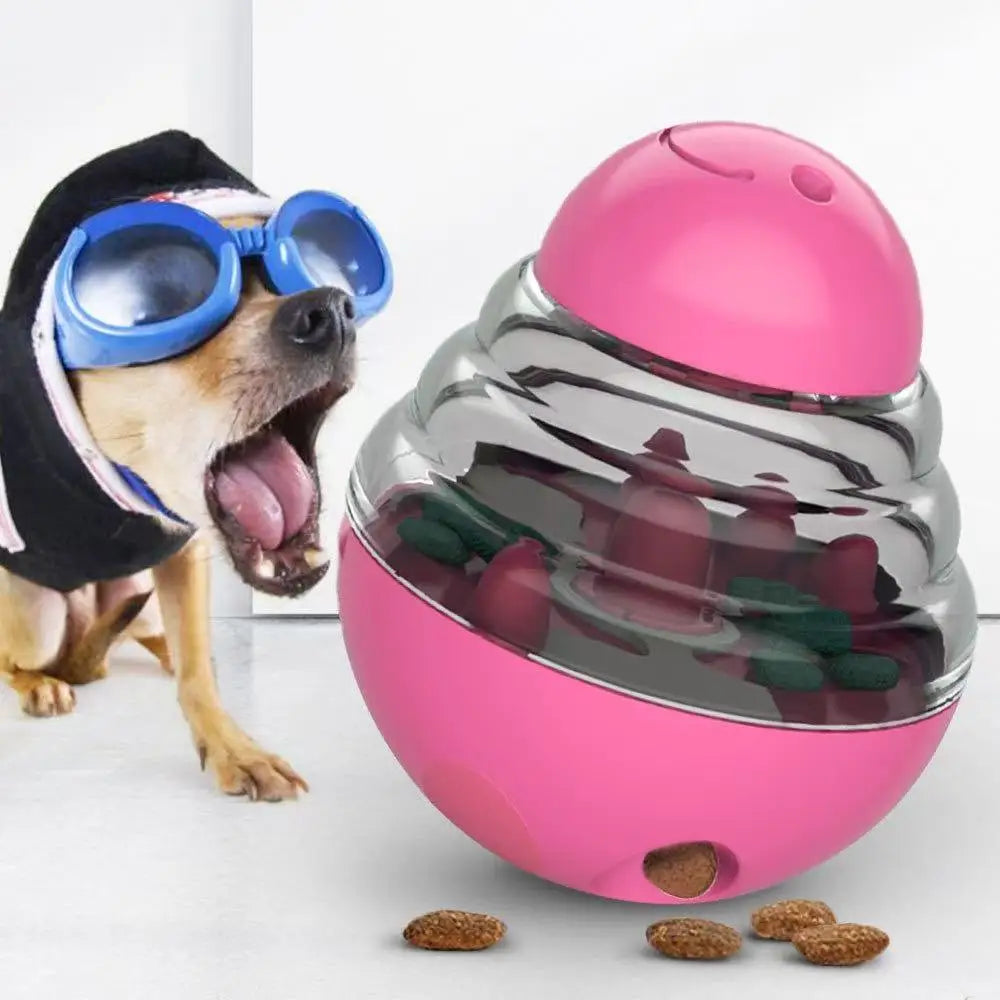 Pink dog toy with treats inside next to a dog wearing goggles.