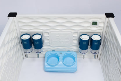 Pet crate with blue cups and a bowl on a white background