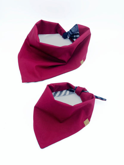 Two magenta bandanas with plaid accents on a white background