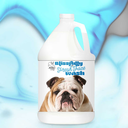 Gallon jug of 'Blissfully Fresh Face Wash' with a bulldog's face on the label against a blue gradient background.