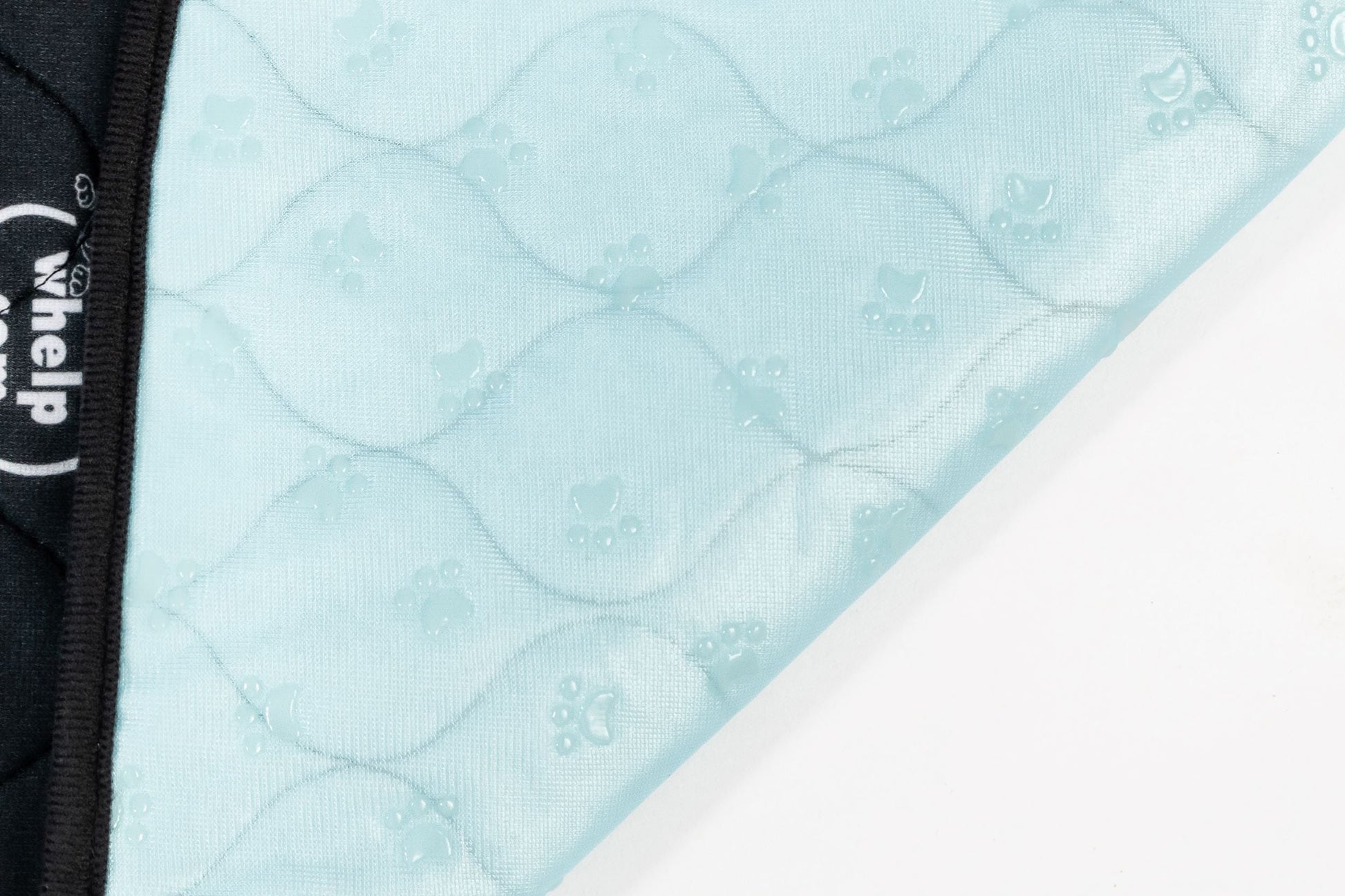 Light blue quilted fabric with a visible brand logo on a white background