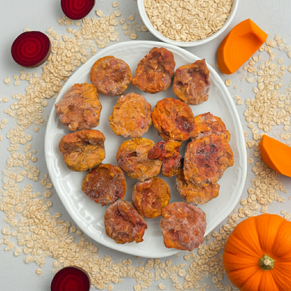 Dried apricots on a white plate with oats and a small pumpkin on a light gray background