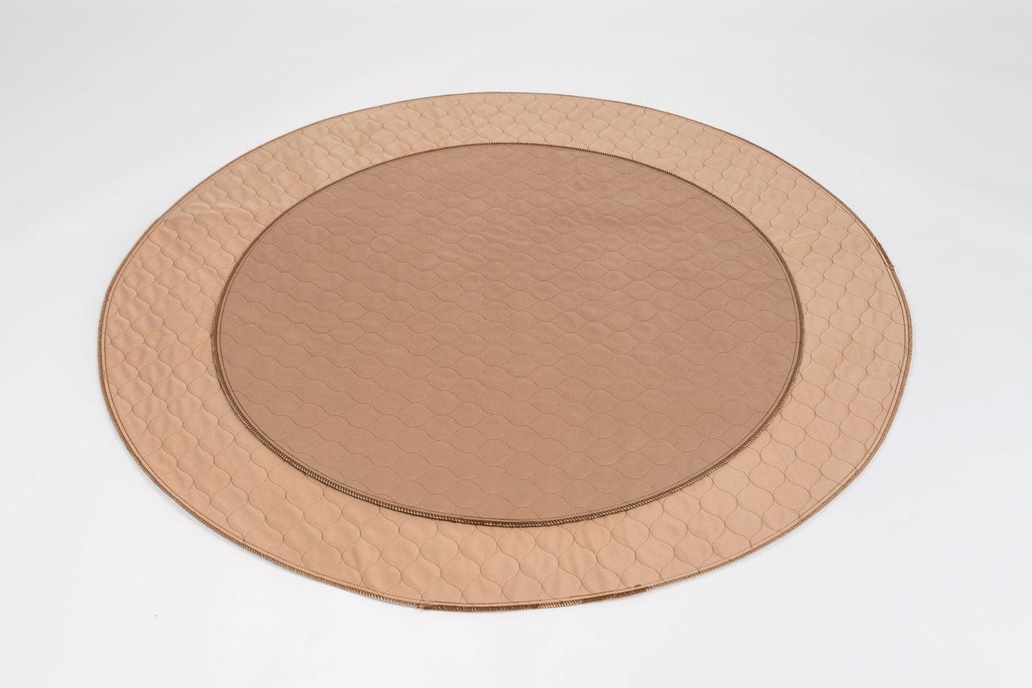 Round copper metal tray on a white background