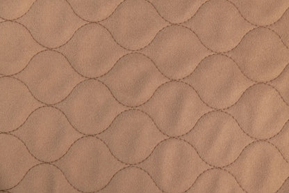 Close-up of brown quilted fabric texture