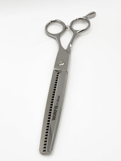 Silver hairdressing scissors with 'Noreva' branding on a white background