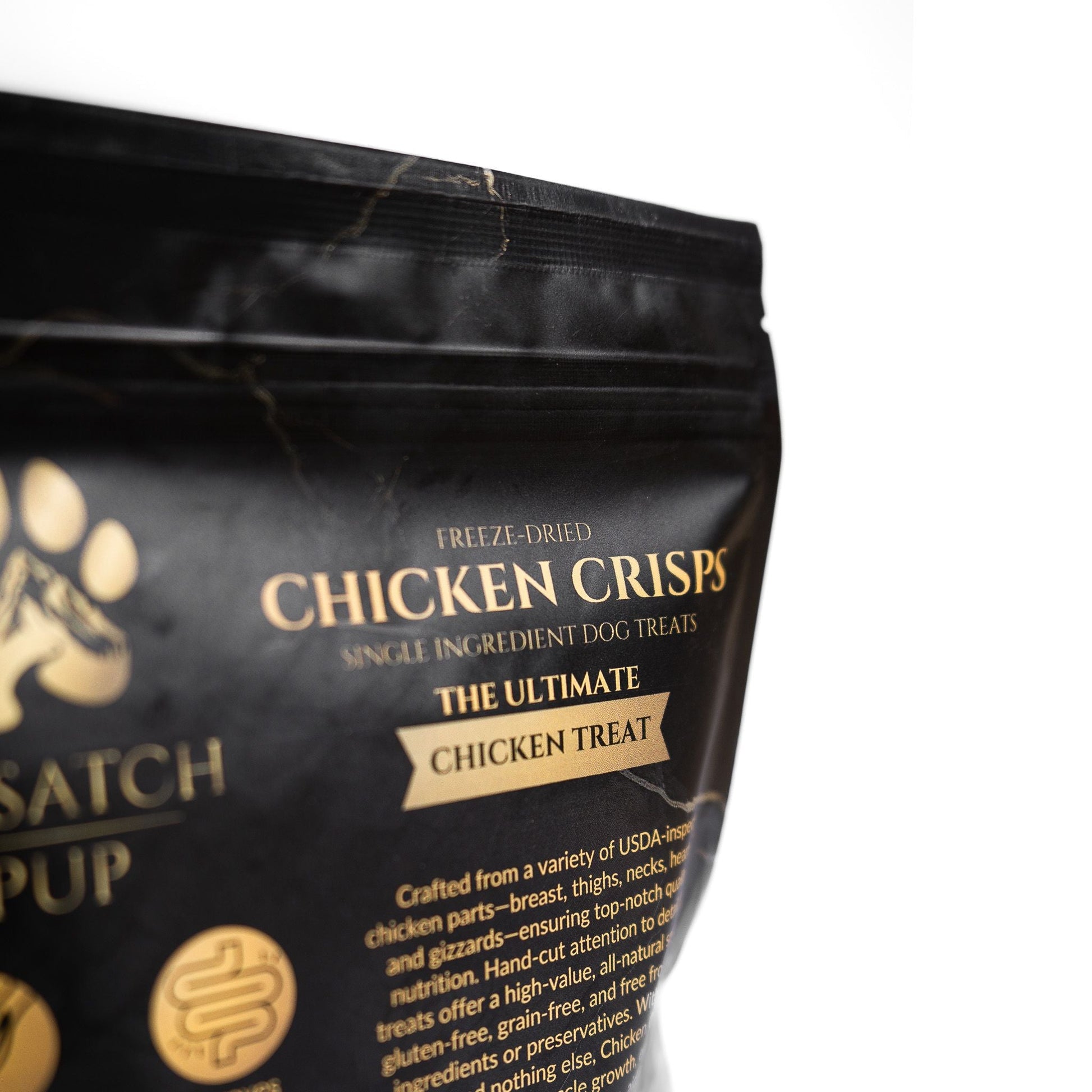 Black packaging of Satch Pup Chicken Crisps dog treats with gold text on a white background