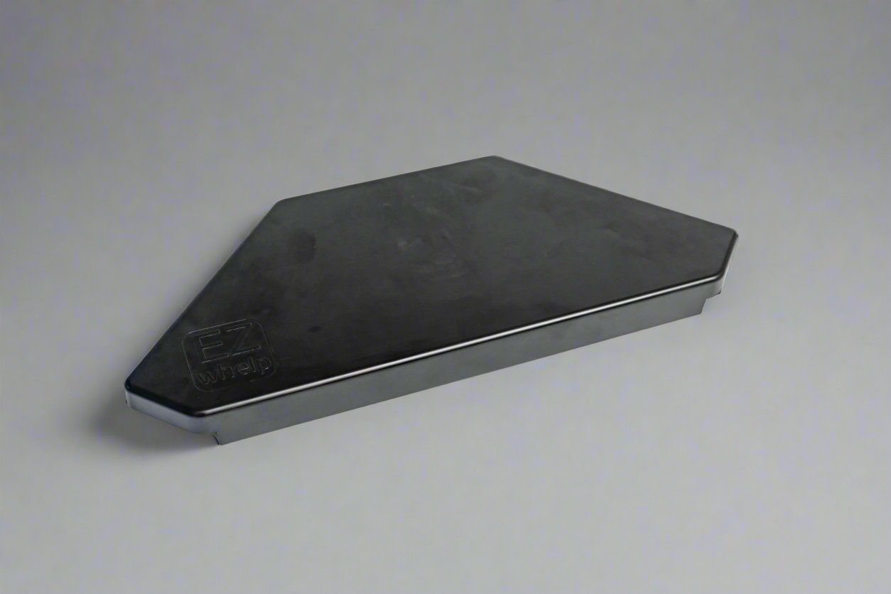 Black metal angle iron on a gray background