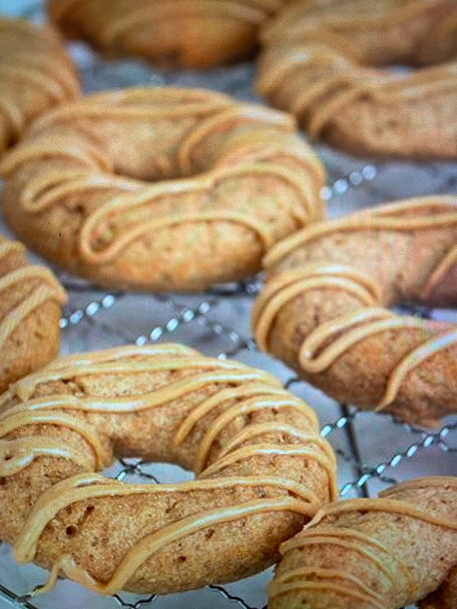 Donuts with a glaze on a cooling rack