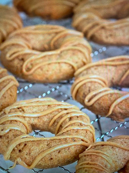Donuts with a glaze on a cooling rack