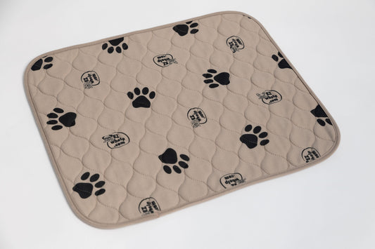 Beige pet mat with black paw prints on a white background