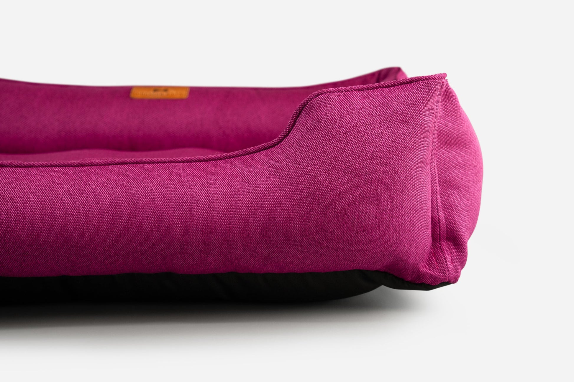 Purple yoga mat with a brand label on a white background