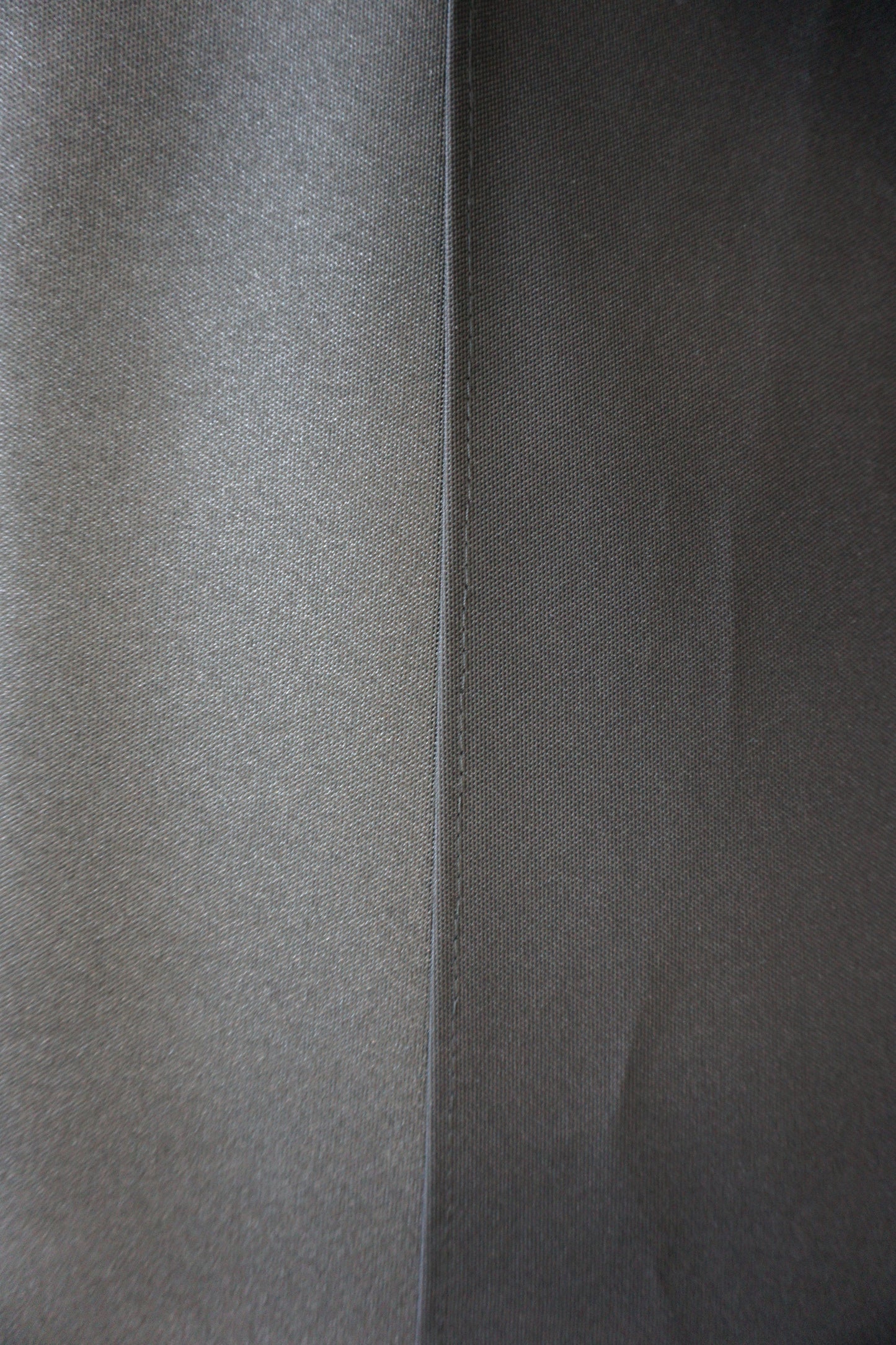Close-up of gray fabric with a subtle pattern