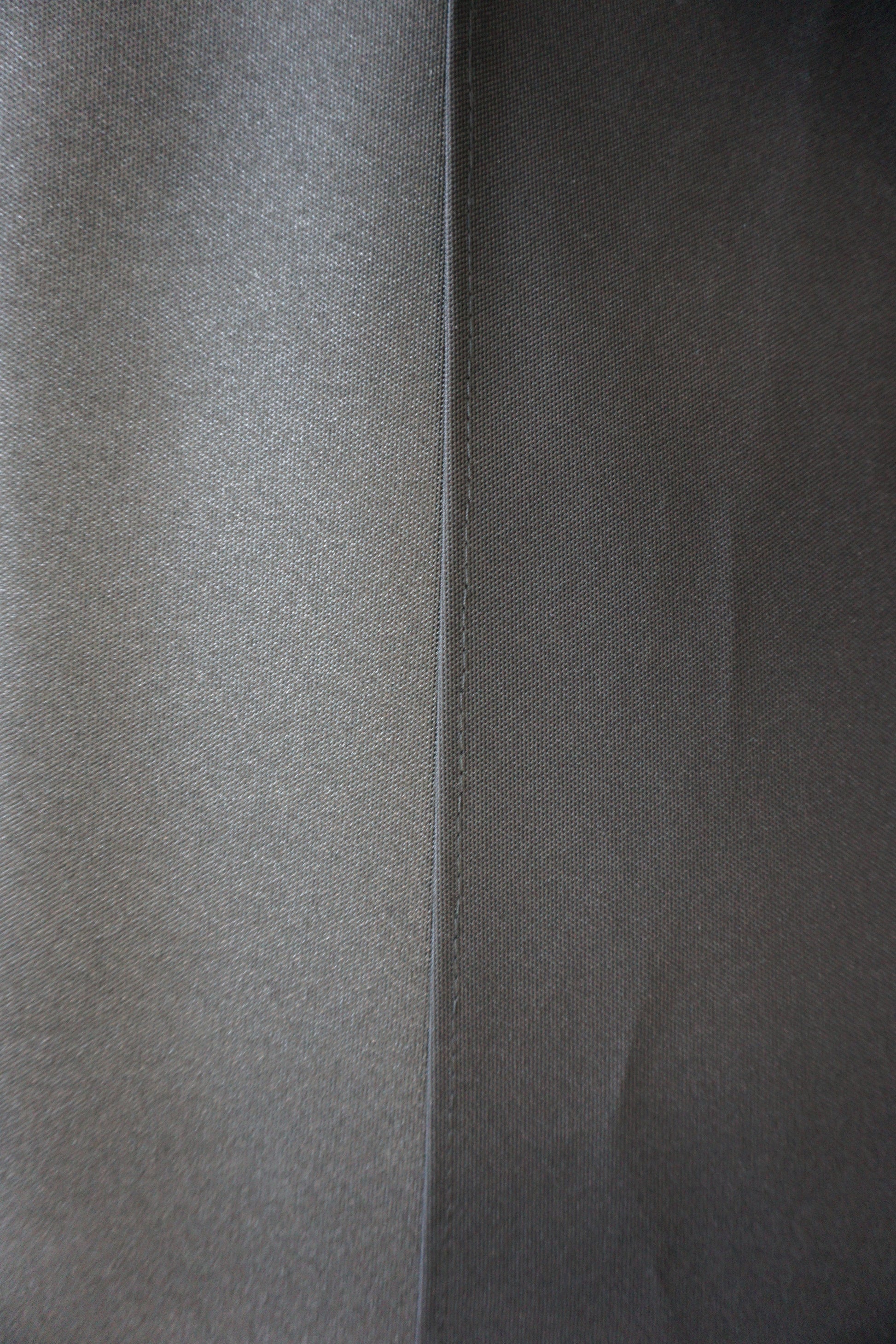 Close-up of gray fabric with a subtle pattern