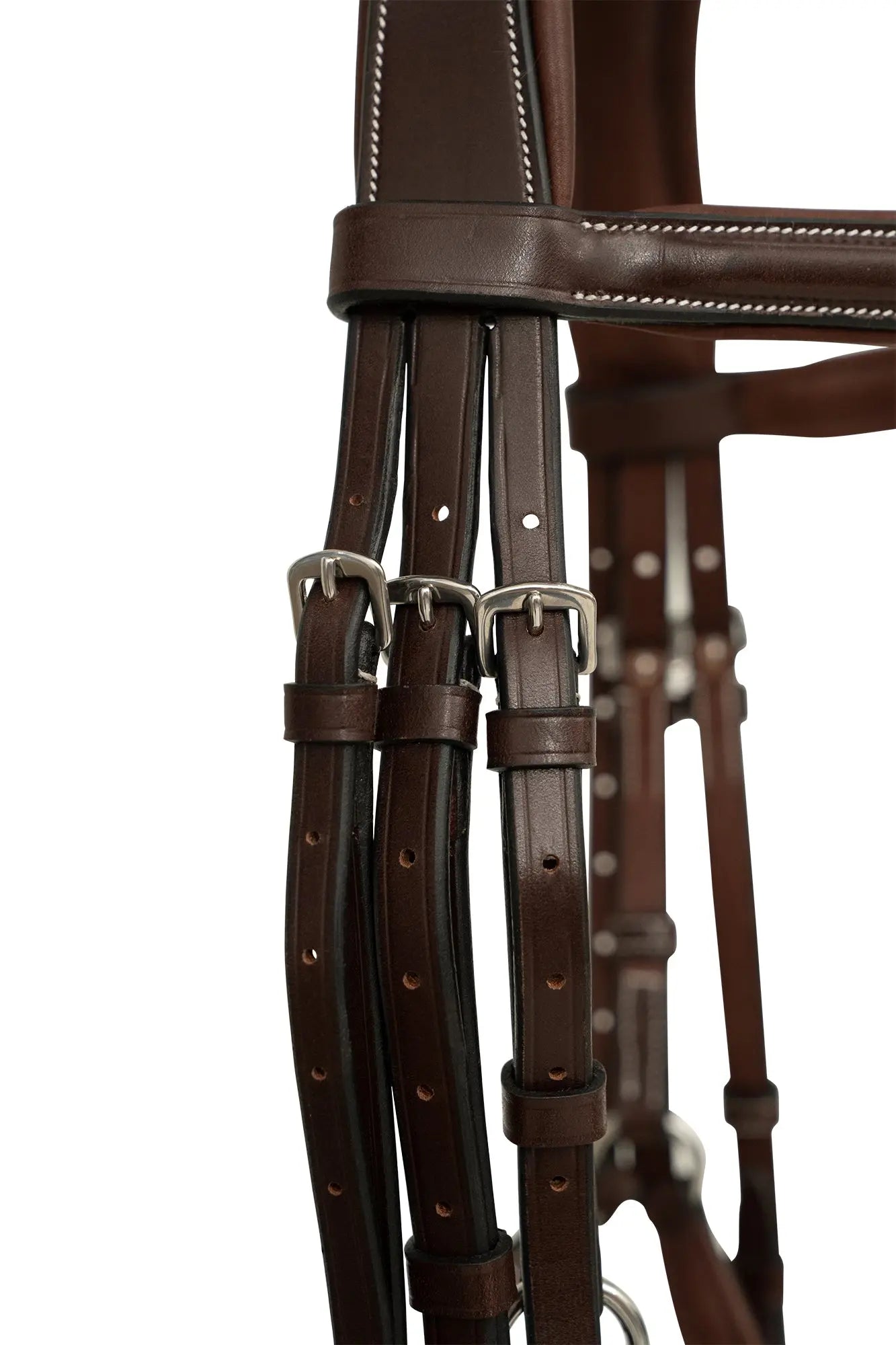 Close-up of a brown leather bridle with metal hardware on a white background