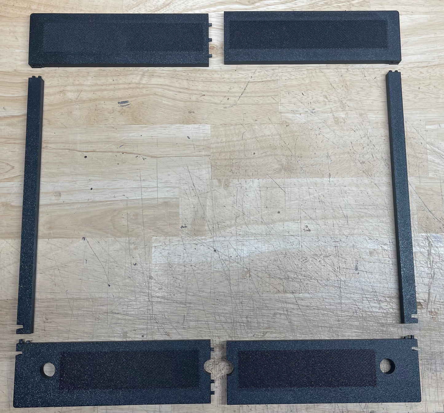 Black rubber mat set on a wooden surface