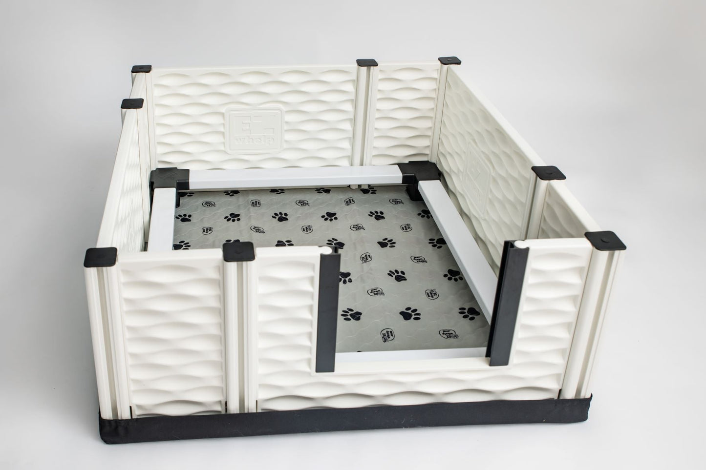 Pet playpen with a paw print mat on a gray background