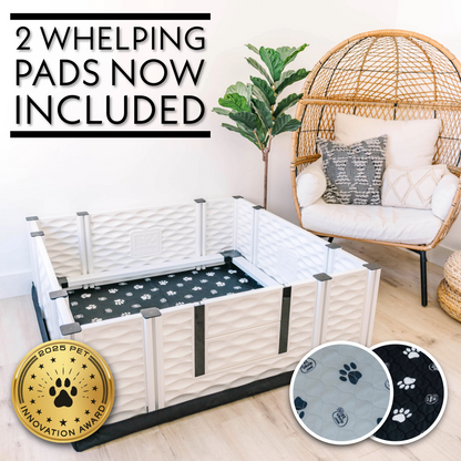 Pet playpen with whelping pads included, shown in a home setting.