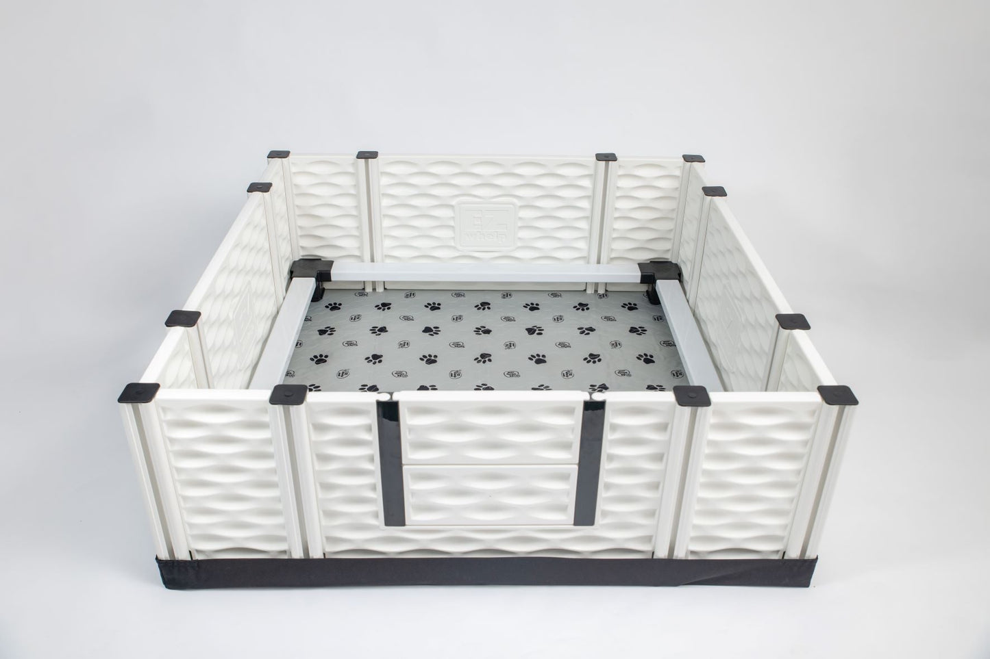Pet playpen with a gray mat on a white background