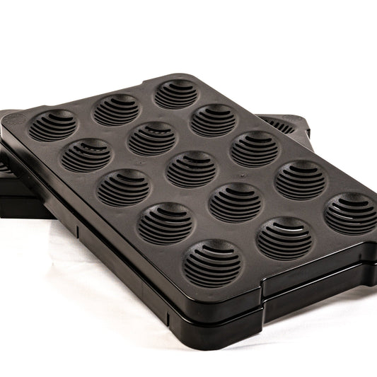Black waffle maker with multiple round cooking sections on a white background