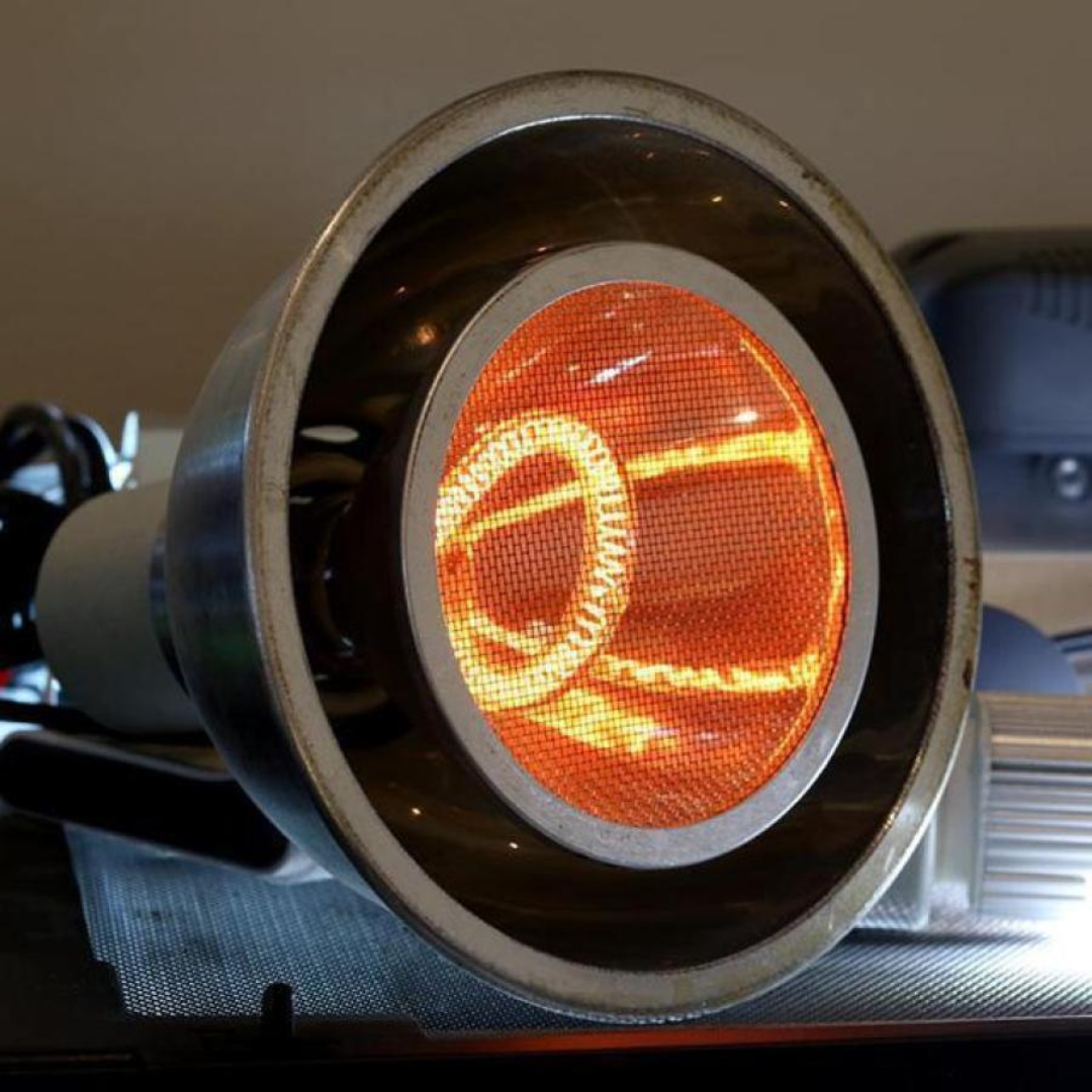 Close-up of a car headlight with a visible orange glow