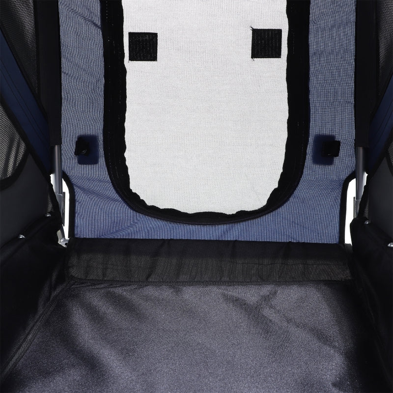 Close-up of a pet carrier with a mesh door and black trim.