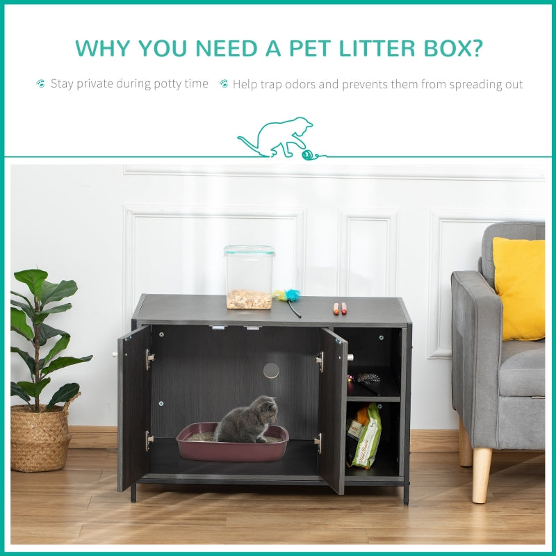 Pet litter box inside a cabinet with a cat using it, in a room with a plant and sofa.