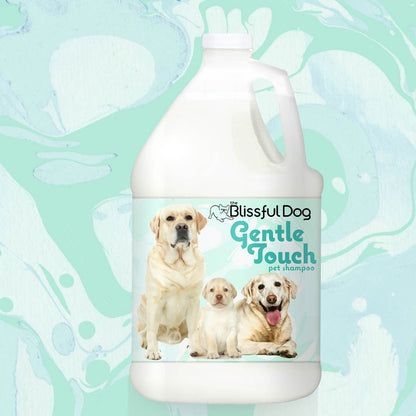 Gallon jug of Blissful Dog Gentle Touch pet shampoo with dogs on a light green background
