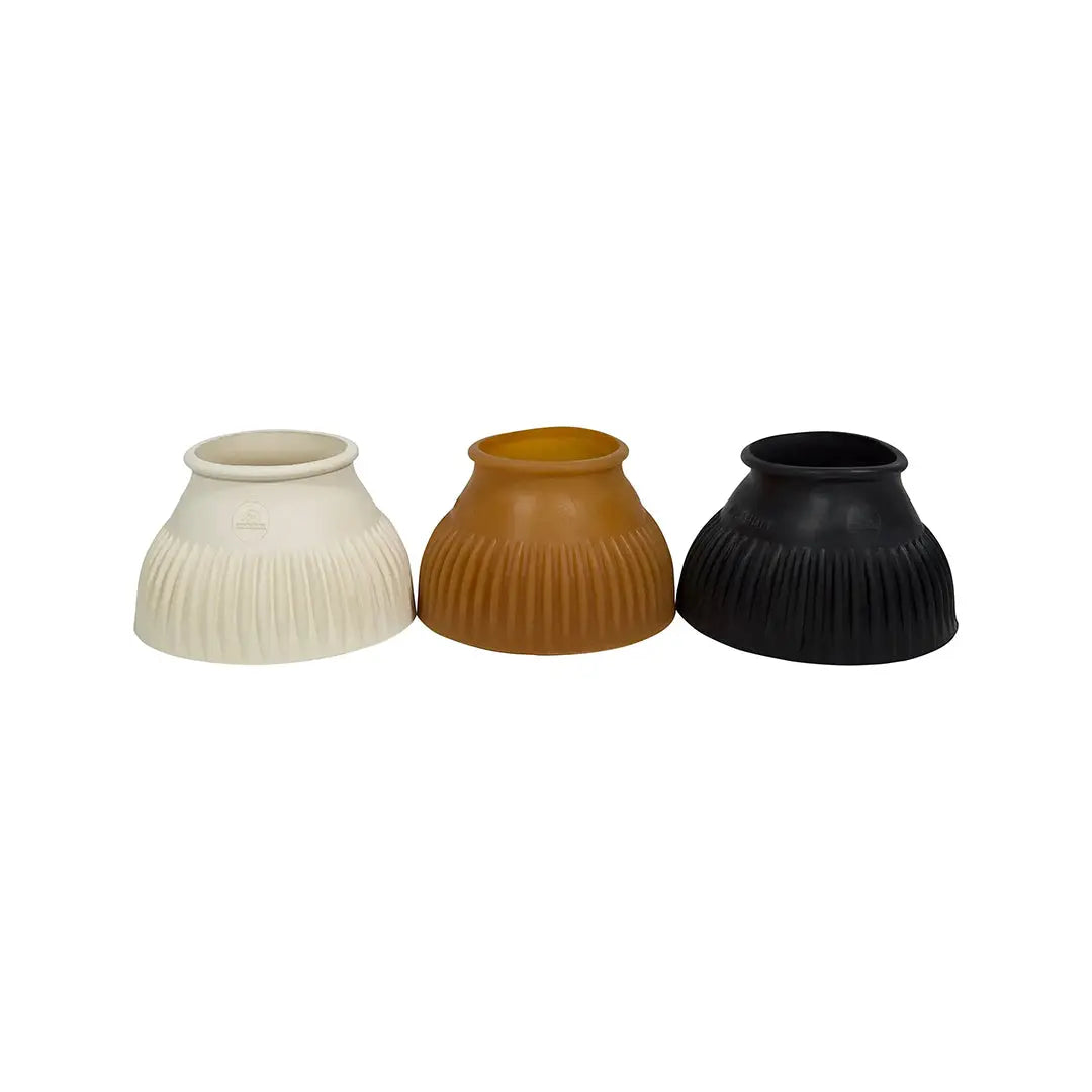 Three ribbed ceramic vases in white, brown, and black on a white background