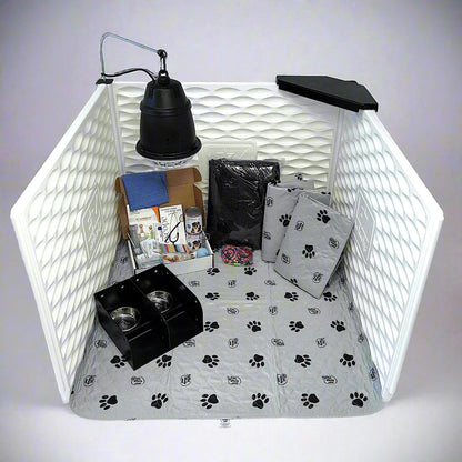 Pet playpen with accessories including a lamp, food bowls, and toys on a white background
