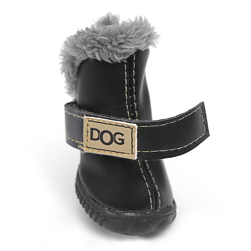 Black dog boot with gray fur lining and 'DOG' label on a white background