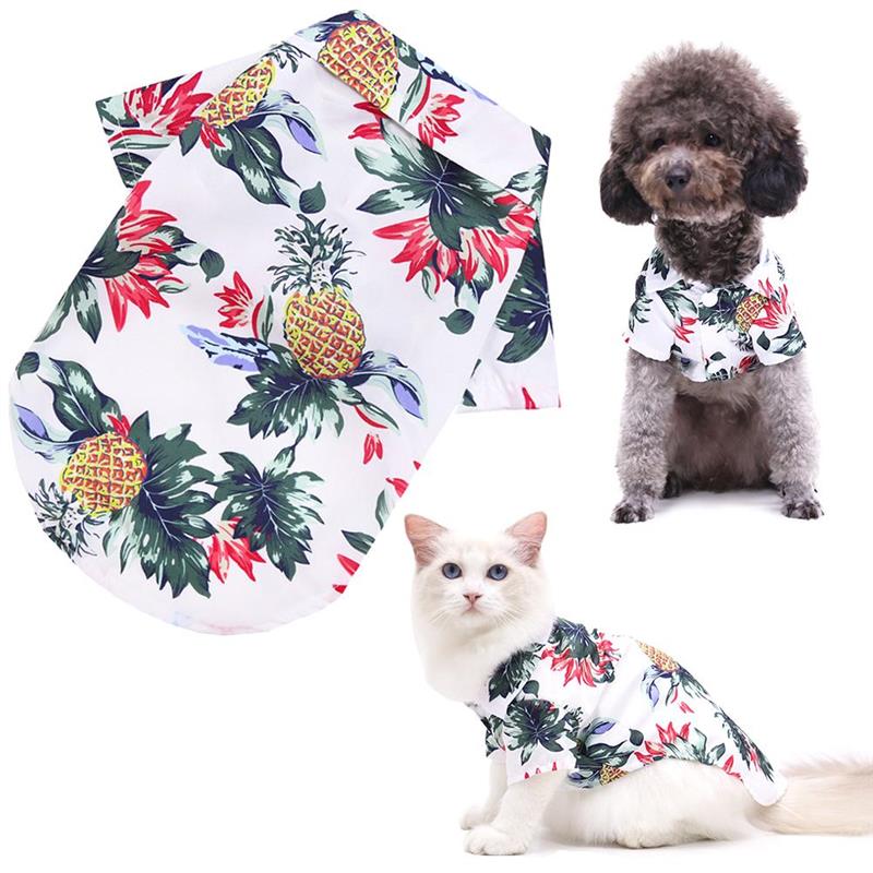 Floral-patterned pet shirt on a white background with a dog and cat wearing it.
