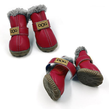 Red dog boots with gray fur lining and 'DOG' label on a white background