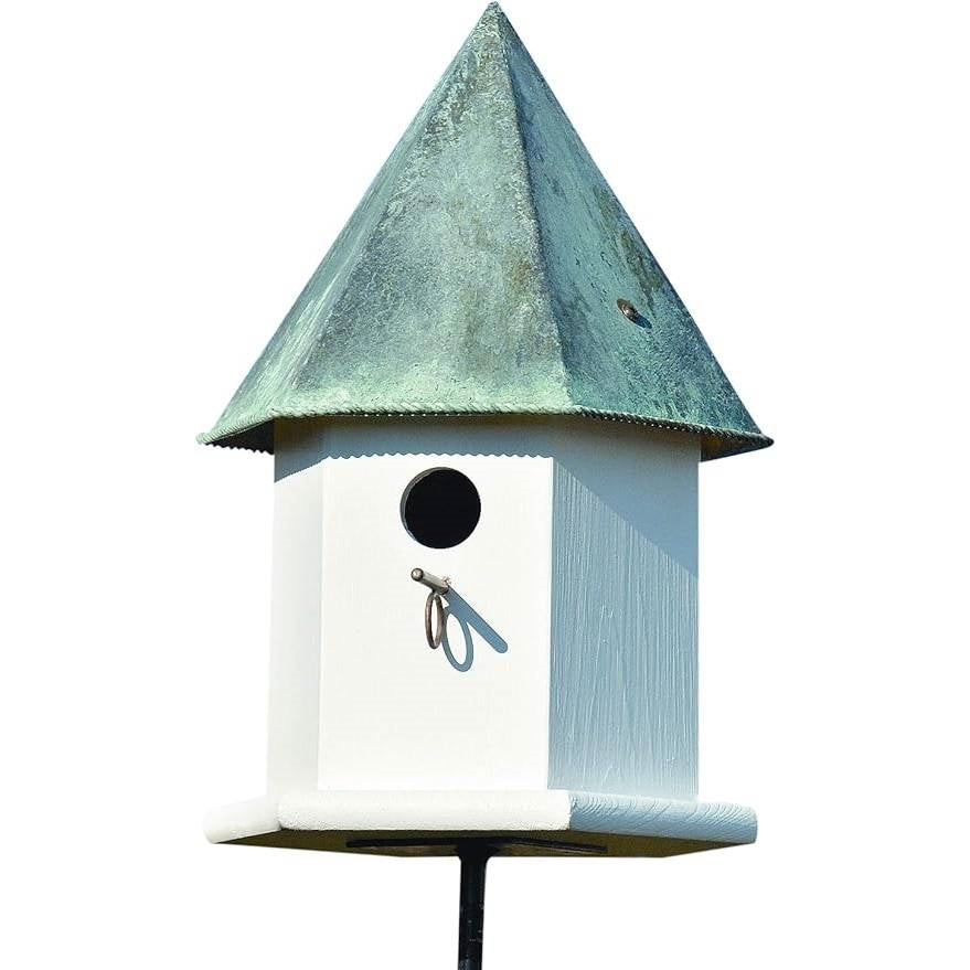 White birdhouse with a greenish-blue roof on a white background